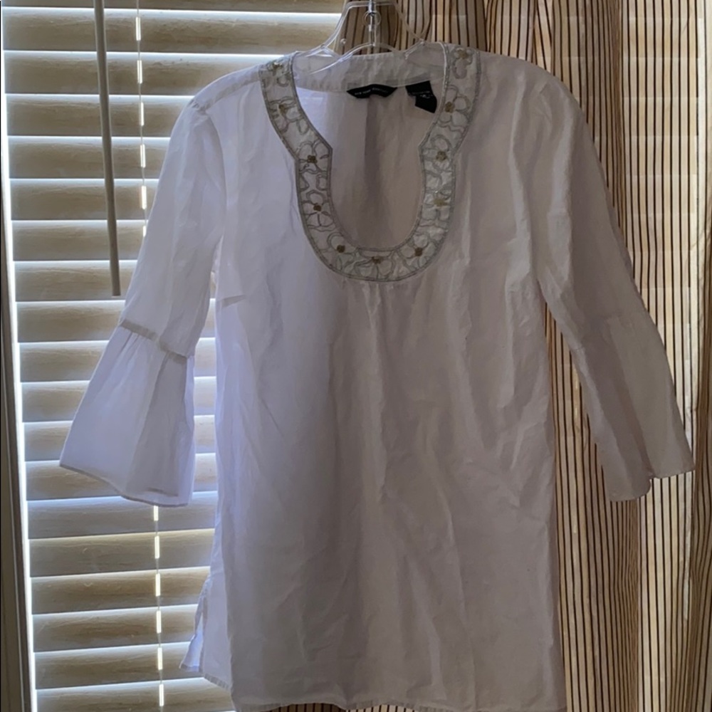 White tunic with silver flower beading around neck
